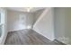 Bright living room featuring hardwood floors, and a door leading to the backyard at 2500 S Ridge Ave, Kannapolis, NC 28083