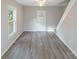 Bright living room featuring hardwood floors, and a door leading to the backyard at 2500 S Ridge Ave, Kannapolis, NC 28083