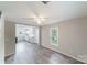 Open living room with view into kitchen and hardwood floors at 2500 S Ridge Ave, Kannapolis, NC 28083