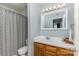 Bathroom featuring a vanity, decorative mirror and a shower-tub combo, creating a refreshing space at 421 N Church St # 12F, Charlotte, NC 28202