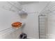 Efficient walk-in closet with wire shelving for optimal storage and organization at 421 N Church St # 12F, Charlotte, NC 28202