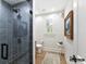 Clean bathroom with a walk-in shower, toilet, and light wood floor at 5053 Townsend Rd, Lancaster, SC 29720
