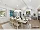 Bright dining room with a large table, chandelier, and access to the living room at 5053 Townsend Rd, Lancaster, SC 29720