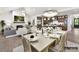 Elegant dining room with a large table and kitchen views at 5053 Townsend Rd, Lancaster, SC 29720