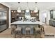 Modern kitchen with large island, stainless steel appliances, and wood cabinets at 5053 Townsend Rd, Lancaster, SC 29720