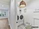 Bright laundry room with washer, dryer, and ample storage at 5053 Townsend Rd, Lancaster, SC 29720