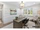 Home office with wood desk, chair, and large artwork at 5053 Townsend Rd, Lancaster, SC 29720