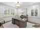 Bright home office with natural light, plantation shutters, and stylish decor at 5053 Townsend Rd, Lancaster, SC 29720