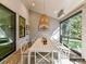 Bright screened porch with a dining area and outdoor lighting at 5053 Townsend Rd, Lancaster, SC 29720