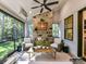 Cozy screened porch with fireplace and seating area, perfect for relaxing at 5053 Townsend Rd, Lancaster, SC 29720