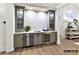 Basement wet bar with glass-front cabinets, wine cooler, and dishwasher at 5053 Townsend Rd, Lancaster, SC 29720