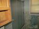 Small bathroom with shower and wood cabinets at 744 N Little Egypt Rd, Denver, NC 28037