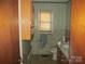 Bathroom with wood cabinets and a shower/tub combo at 744 N Little Egypt Rd, Denver, NC 28037