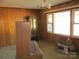 Simple dining room with wood paneling and large windows at 744 N Little Egypt Rd, Denver, NC 28037