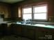Classic kitchen with wood cabinets and double sink at 744 N Little Egypt Rd, Denver, NC 28037