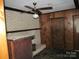Living room with brick fireplace, wood paneling and ceiling beams at 744 N Little Egypt Rd, Denver, NC 28037