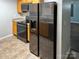 Kitchen with black refrigerator and wood cabinets at 842 Wilcrest Ct, York, SC 29745