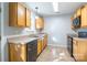 Kitchen with wood cabinets, black appliances, and tile floor at 842 Wilcrest Ct, York, SC 29745