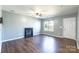Living room with hardwood floors, fireplace, and door at 842 Wilcrest Ct, York, SC 29745