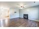 Living room with fireplace, hardwood floors, and ceiling fan at 842 Wilcrest Ct, York, SC 29745