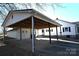 Covered carport with attached storage and concrete flooring at 9 N 11Th Ave, Maiden, NC 28650