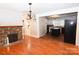 Dining room with hardwood floors and a stone fireplace at 9 N 11Th Ave, Maiden, NC 28650