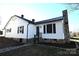Charming white house with stonework, a walkway, and landscaping at 9 N 11Th Ave, Maiden, NC 28650