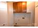 Functional laundry area with overhead cabinets at 9 N 11Th Ave, Maiden, NC 28650