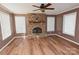 Spacious living room with stone fireplace and hardwood floors at 9 N 11Th Ave, Maiden, NC 28650