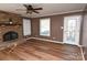 Living room features hardwood floors, stone fireplace, and French doors at 9 N 11Th Ave, Maiden, NC 28650