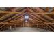 Unfinished attic space with exposed wooden beams at 956 Stony Point Rd, Kings Mountain, NC 28086