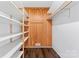 Shelved closet with wooden walls and dark hardwood floor at 956 Stony Point Rd, Kings Mountain, NC 28086