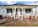 Front porch with white railings and black shutters at 956 Stony Point Rd, Kings Mountain, NC 28086