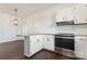 Kitchen with white cabinets, stainless steel appliances, and breakfast bar at 956 Stony Point Rd, Kings Mountain, NC 28086