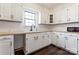 White kitchen with stainless steel appliances and farmhouse sink at 956 Stony Point Rd, Kings Mountain, NC 28086