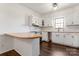 Modern kitchen with white cabinets and stainless steel appliances at 956 Stony Point Rd, Kings Mountain, NC 28086