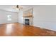 Living room featuring hardwood floors and a brick fireplace at 956 Stony Point Rd, Kings Mountain, NC 28086