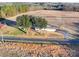 Aerial view of a ranch home on a large lot with mature trees at 101 S Moose Rd, Mount Pleasant, NC 28124