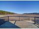 Wooden deck with black metal railings overlooking a field at 101 S Moose Rd, Mount Pleasant, NC 28124