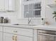 Modern kitchen sink with a chrome faucet and white cabinets at 10114 Tolleson Ave, Charlotte, NC 28277