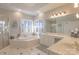 Elegant bathroom with a large soaking tub and double vanity at 104 Fox Den Cir, Statesville, NC 28677