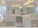 Bright bathroom with double sinks and a large mirror at 104 Fox Den Cir, Statesville, NC 28677