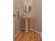 Clean powder room featuring a pedestal sink and hardwood floors at 104 Fox Den Cir, Statesville, NC 28677
