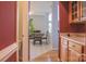View of a dining room with a table and four chairs, seen from a hallway at 104 Fox Den Cir, Statesville, NC 28677