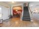 Hardwood floor entryway with staircase and view of dining room at 104 Fox Den Cir, Statesville, NC 28677