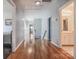 Upstairs hallway with hardwood floors and access to bedrooms and bathrooms at 104 Fox Den Cir, Statesville, NC 28677