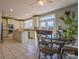 Eat-in kitchen with island and a view into a bright dining area at 104 Fox Den Cir, Statesville, NC 28677