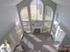 High ceiling living room with large windows and fireplace at 104 Fox Den Cir, Statesville, NC 28677
