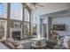 Two-story living room with a fireplace, large windows, and ample seating at 104 Fox Den Cir, Statesville, NC 28677