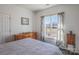Main bedroom with large bed, dresser, and golf course view at 104 Fox Den Cir, Statesville, NC 28677